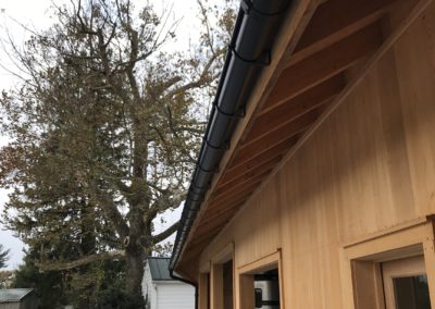 Black gutters from below. Long run across the garage section of the barn.