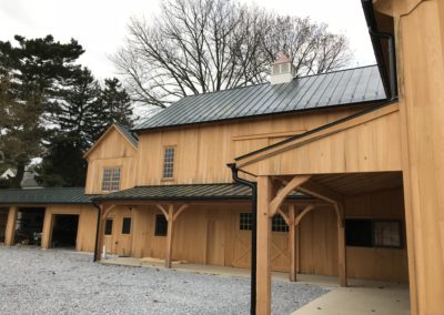 Beautiful barn built by Amish carpenters. Black gutters and downspouts.