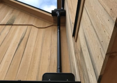 Double set of overflow protection on both the first floor and the second floor as well. Picture taken from below, downspouts lined up nicely.