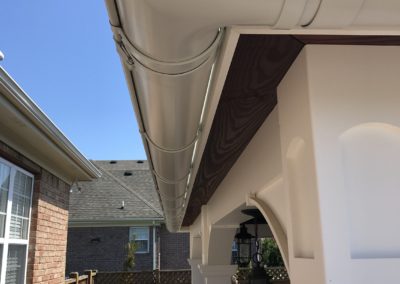 White outside mitter on a gutter. Beautiful in shape and fits perfectly on this pool house.